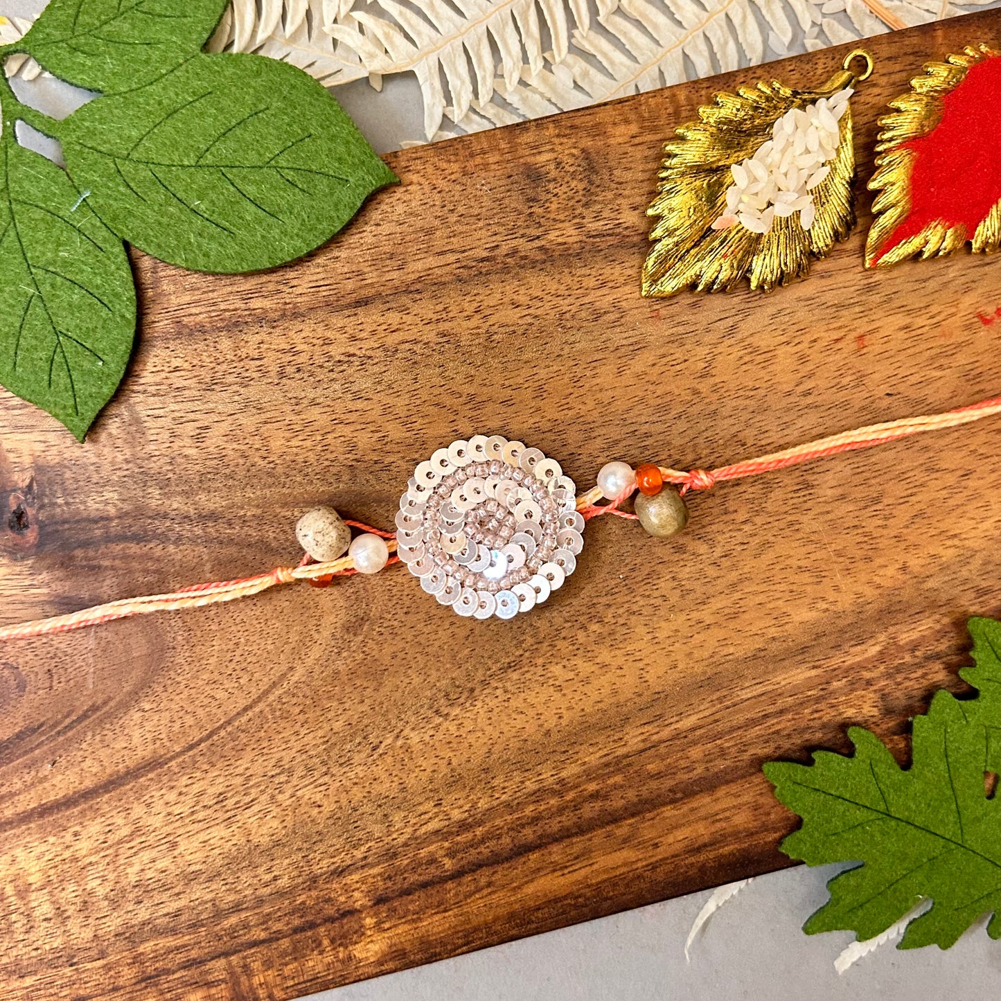 Sequin Chakalya - handcrafted Chakalya for Raksha Bandhan puja, styled view | Traditions4u