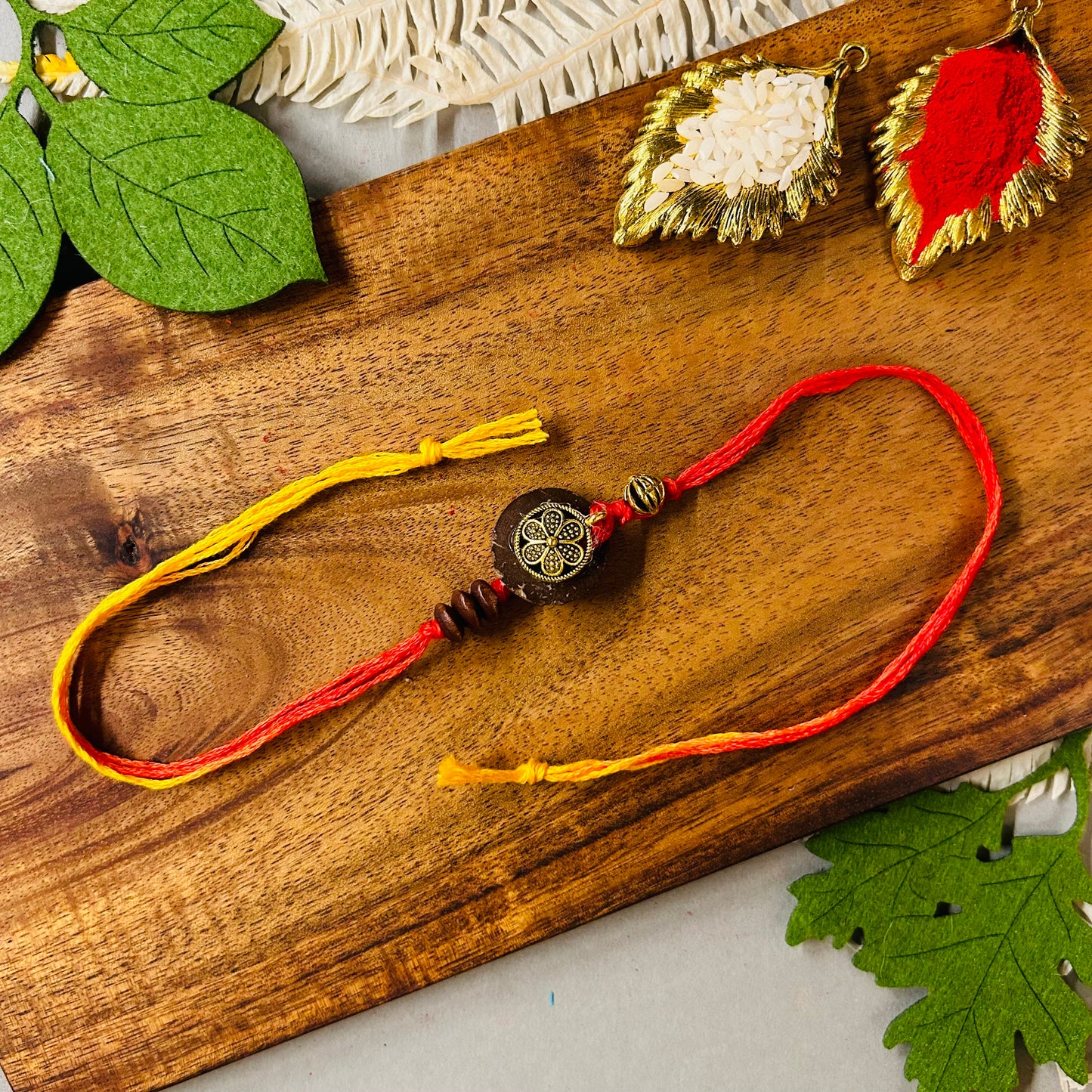 Coconut Shell & Golden Flower Rakhi