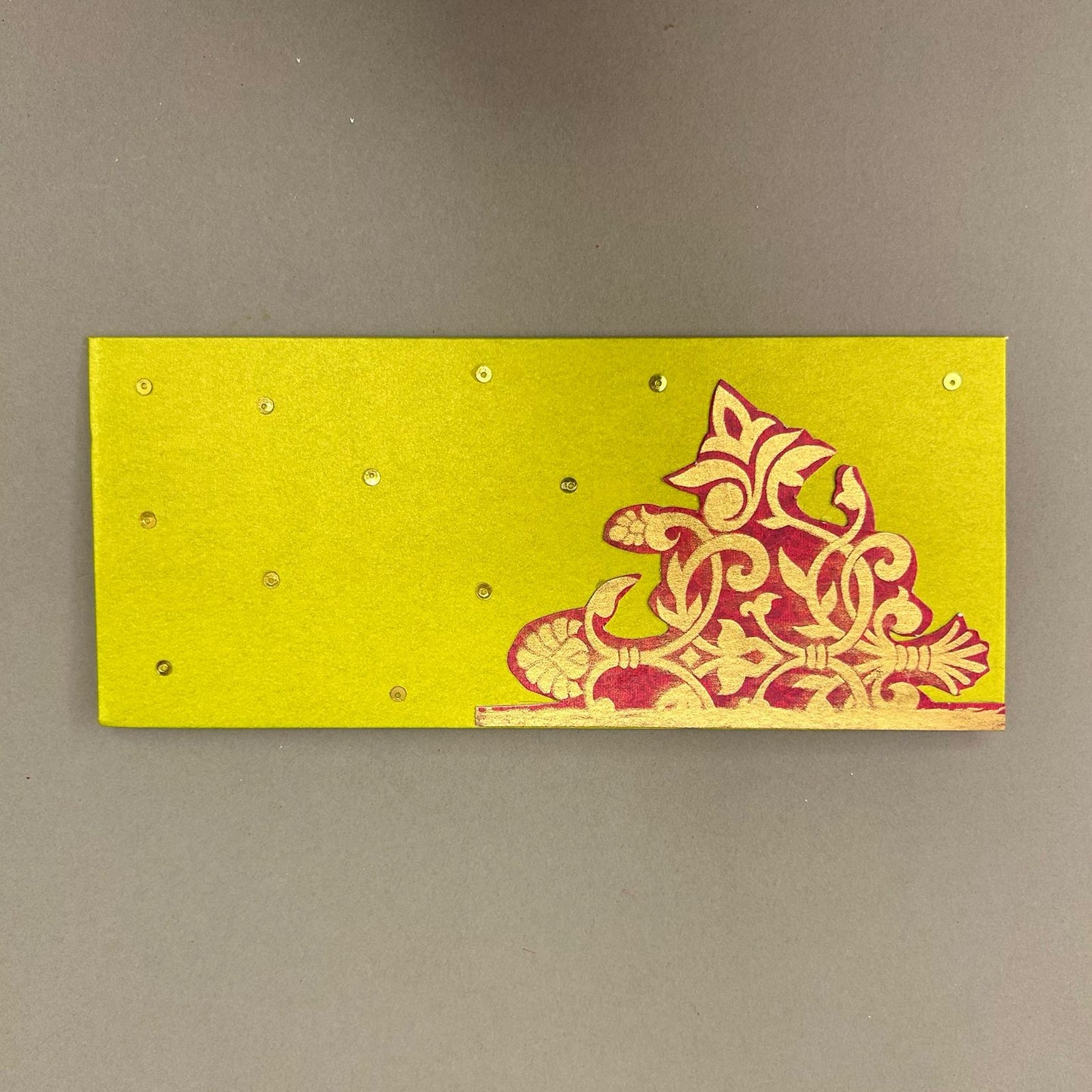 Red Pattern On Green Envelope