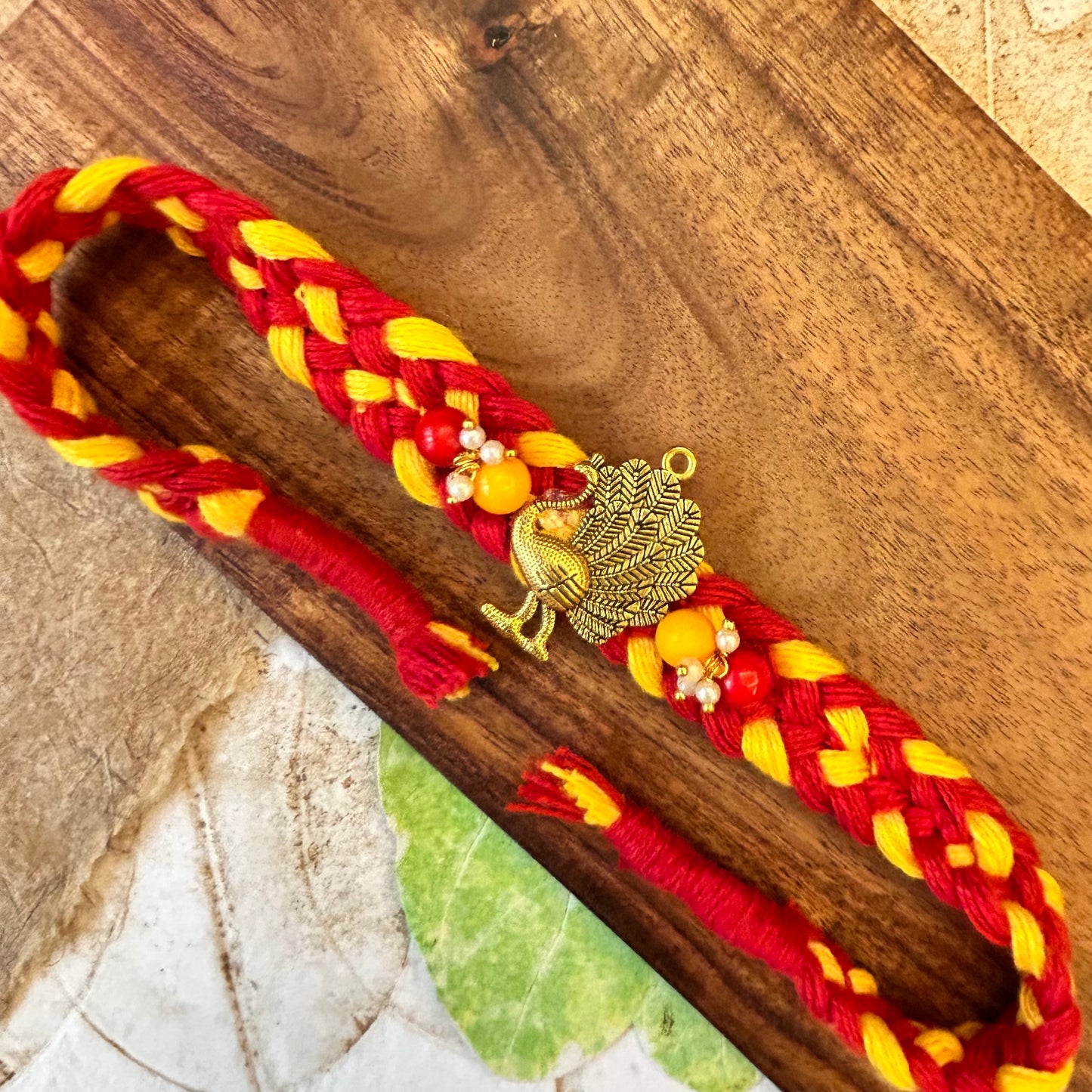 Golden Peacock on broad braid sadi