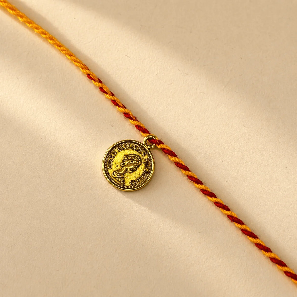 Coin Sadi Rakhi - handcrafted Sadi thread rakhi, alternate view | Traditions4u