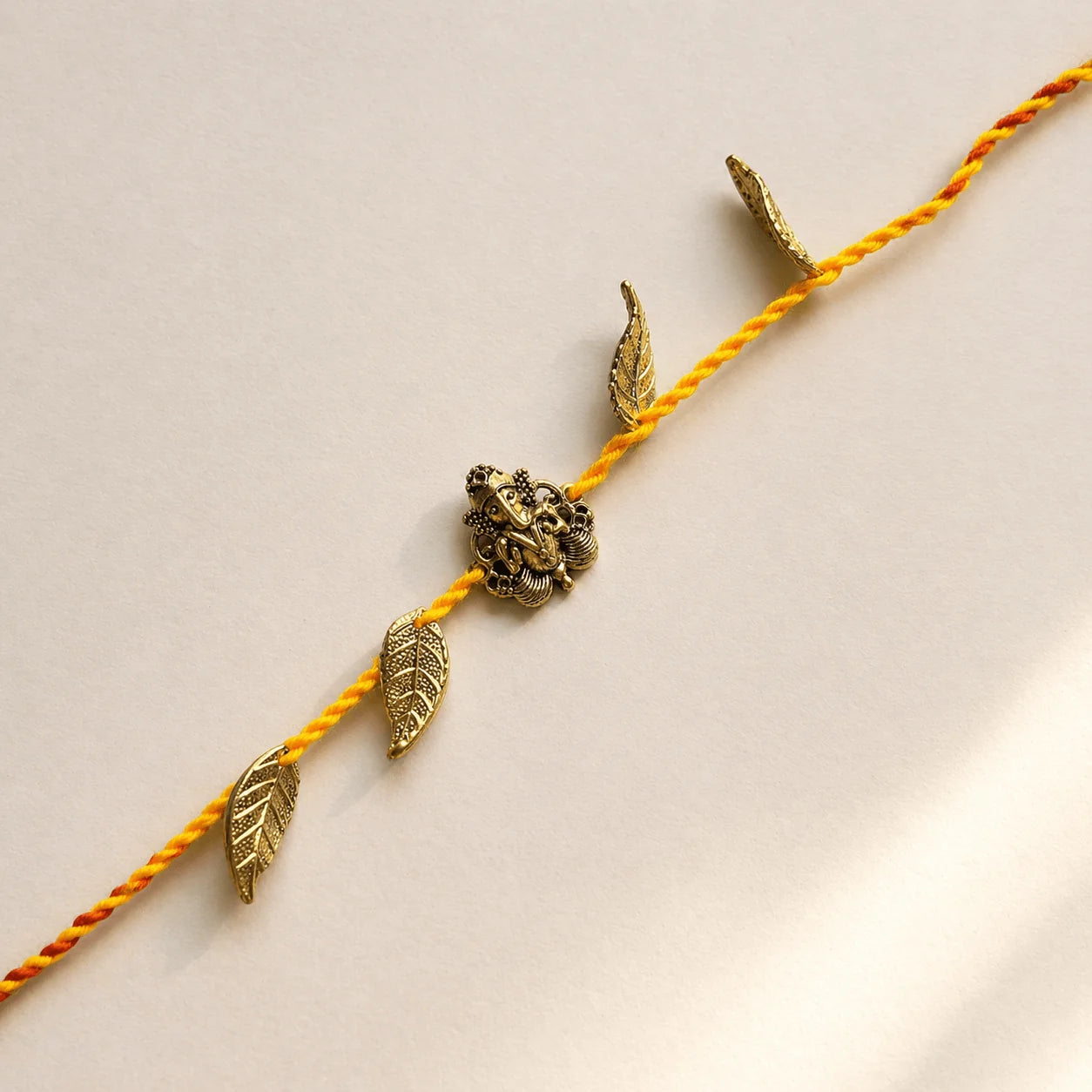 Ganeshji Leaves Charms Sadi Rakhi