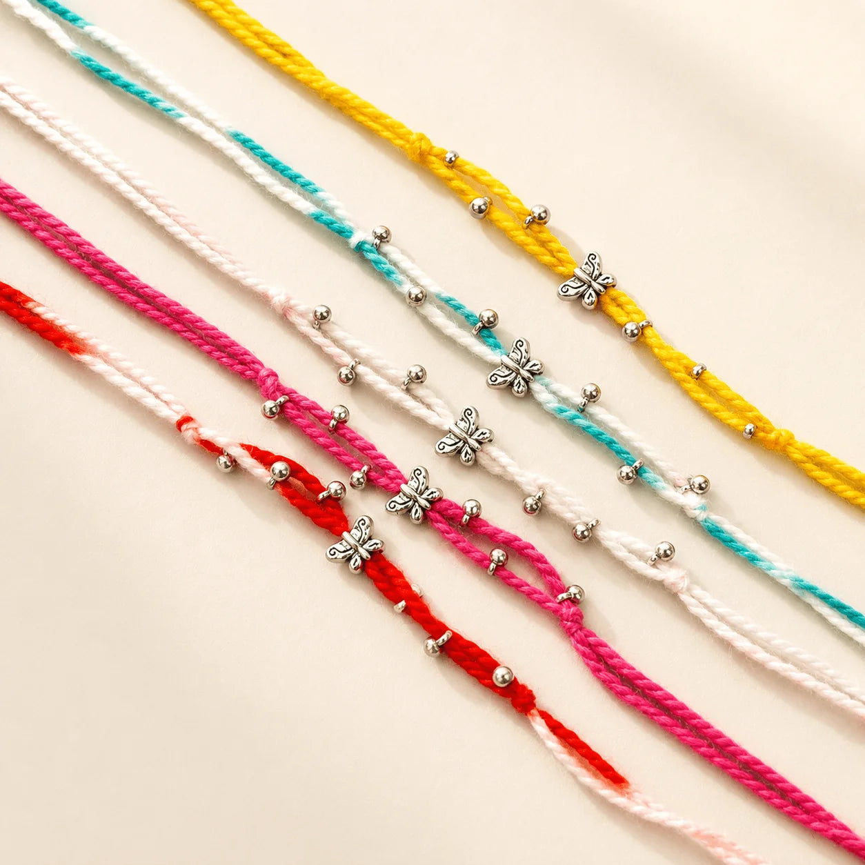 Small Butterfly On Colourful Thread Rakhi