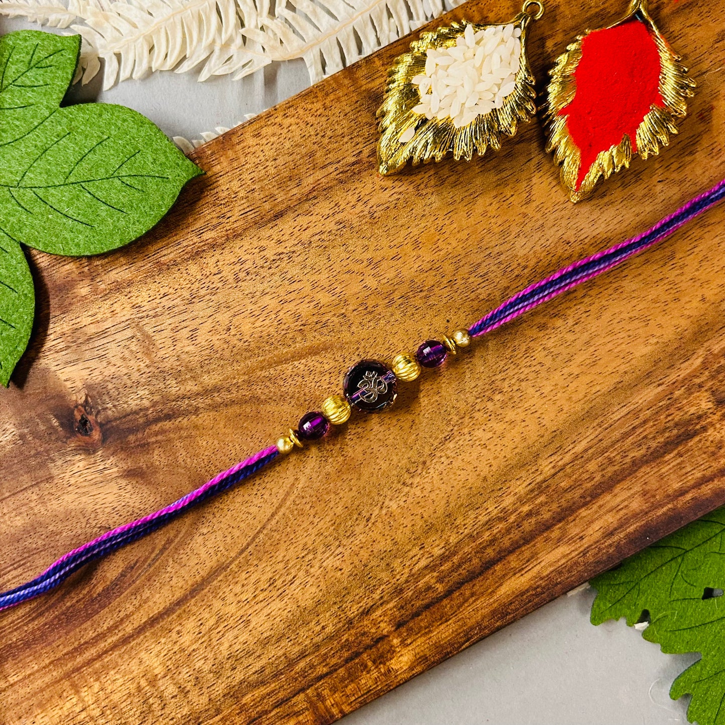 Om On Purple Rainbow Bead Rakhi