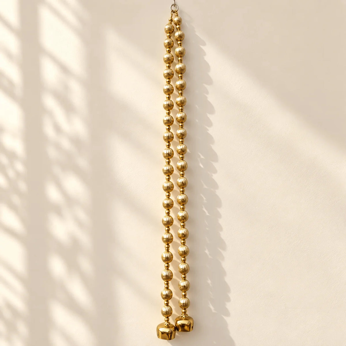 Golden Apple Gota Balls with a Bell Hanging