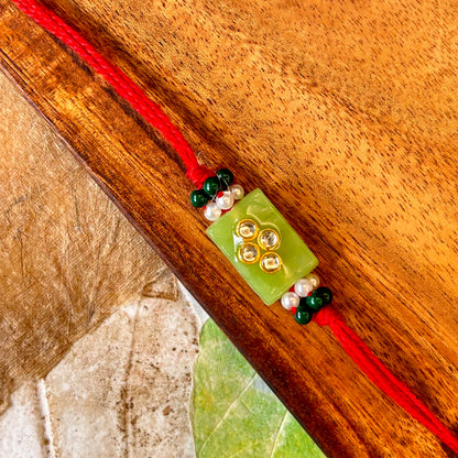 Stone Studded - handcrafted Sadi thread rakhi, back view | Traditions4u