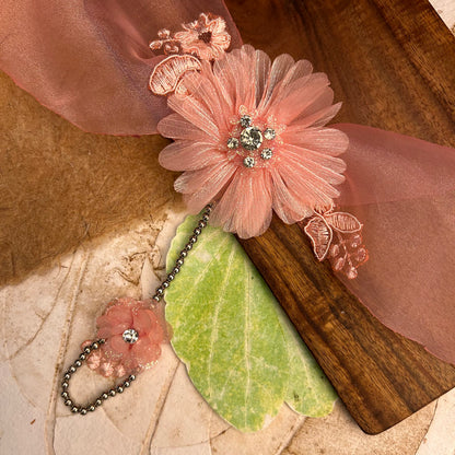 Single Flower Hathphool - handcrafted kids' rakhi for girls, styled view | Traditions4u