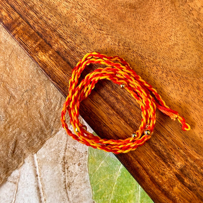 Kishori (gold) - handcrafted Sadi thread rakhi, close-up | Traditions4u