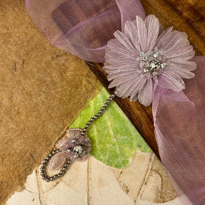 Single Flower Hathphool - handcrafted kids' rakhi for girls, styled close-up | Traditions4u