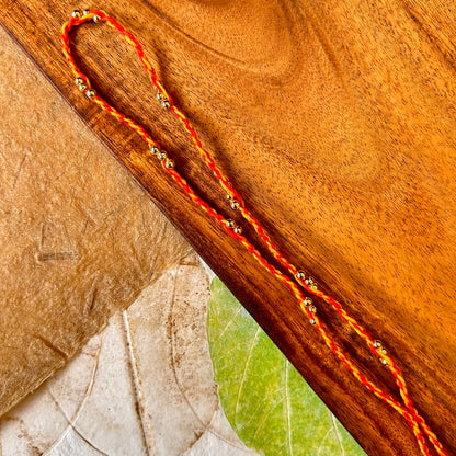 Kishori (gold) - handcrafted Sadi thread rakhi, design detail | Traditions4u