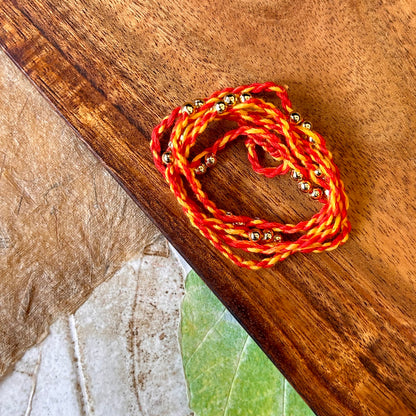 Kishori (gold) - handcrafted Sadi thread rakhi | Traditions4u