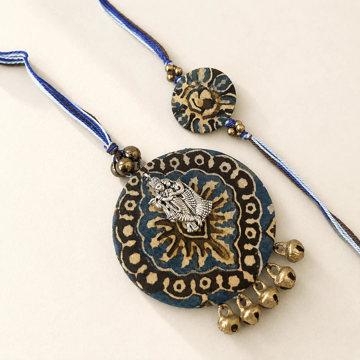 Blue Ajrakh Radha Krishna Rakhi Set - handcrafted Rakhi & Lumba set for bhaiya-bhabhi | Traditions4u