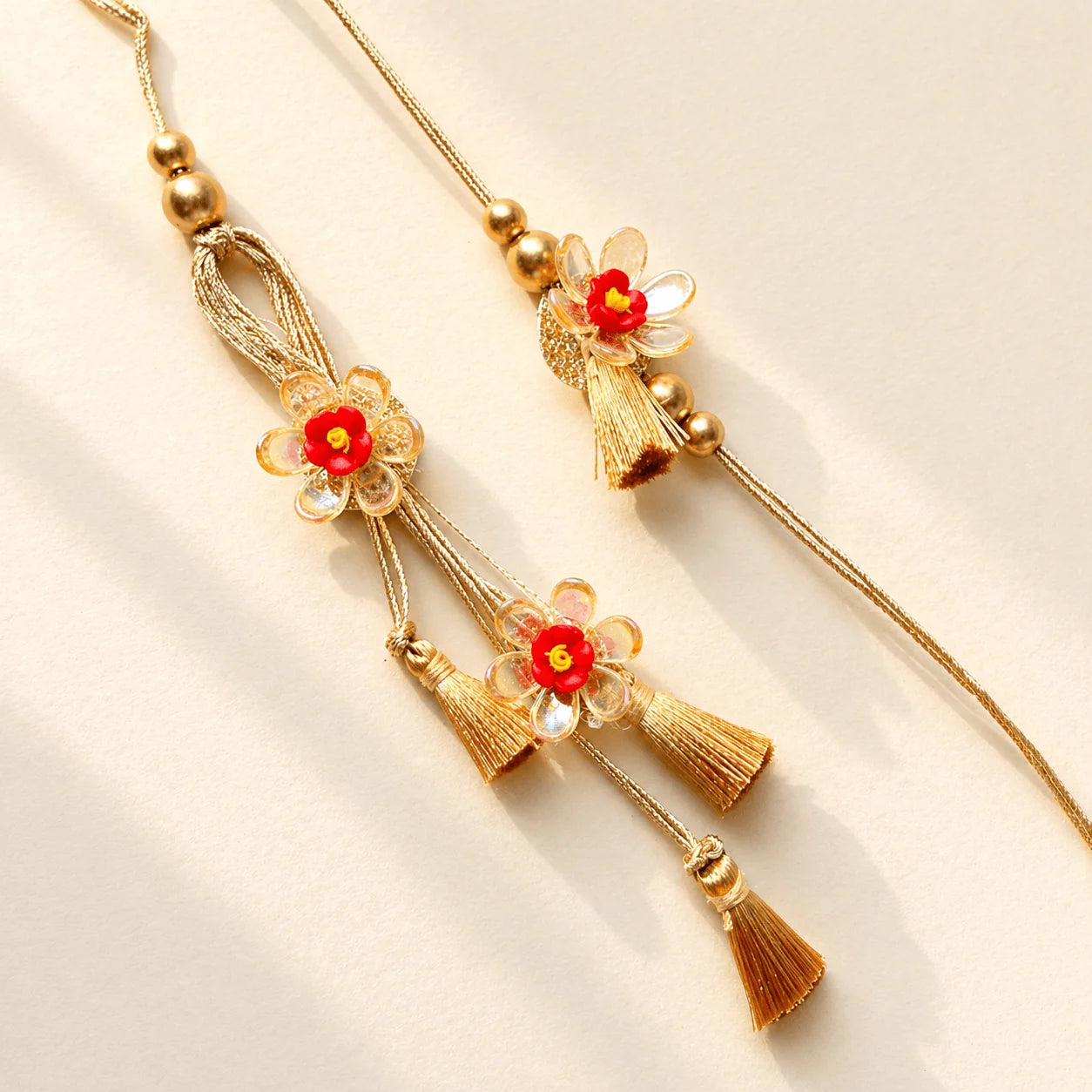 Crystal Red Flower Rakhi Set - handcrafted Rakhi & Lumba set for bhaiya-bhabhi | Traditions4u