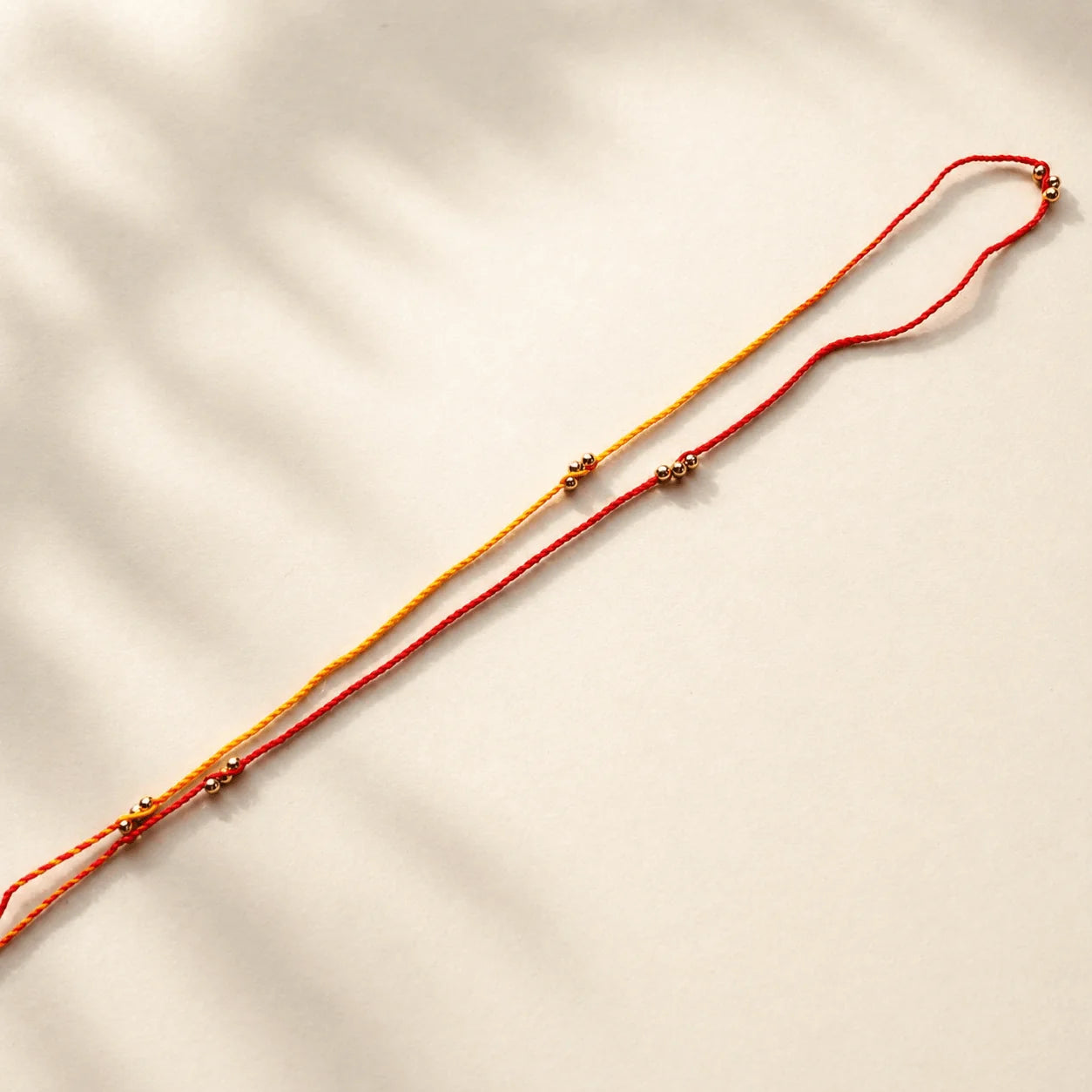 Multi Gold beads on Moli Sadi Rakhi