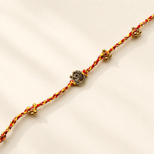 Om Damru Golden Charm Rakhi