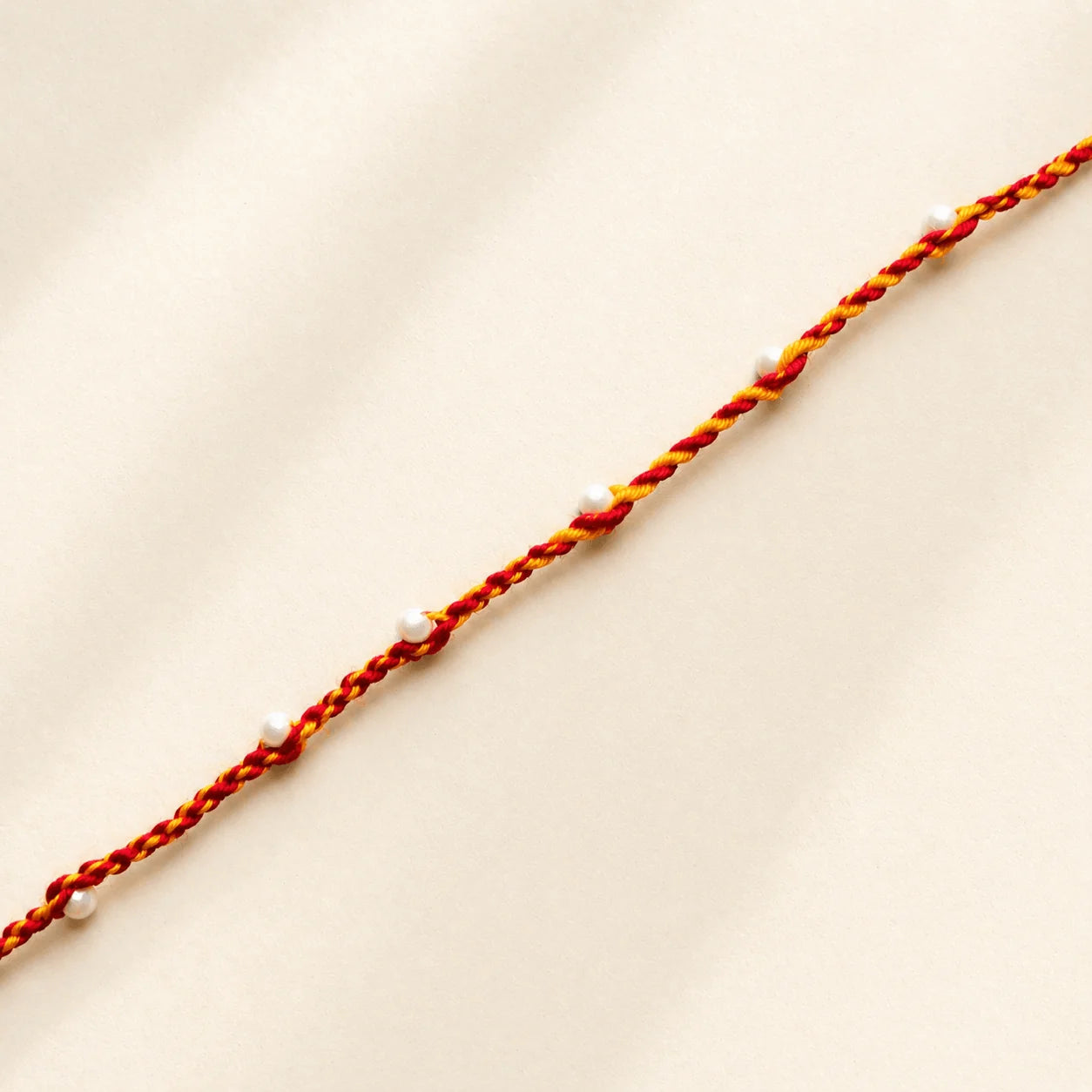 Single White Beads on Moli Sadi Rakhi