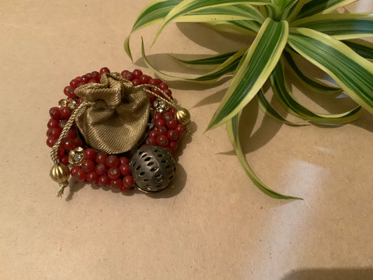 Red beads & golden pouch